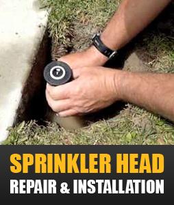 a tech is installing a new sprinkler head